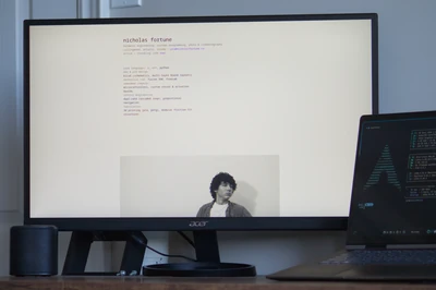 Photo of a monitor displaying nicholasfortune.ca's about page